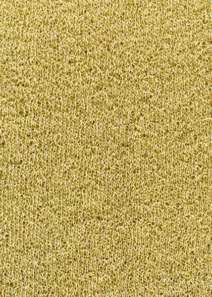 Golden knitted texture background. Knitted pattern with metallic thread