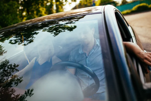 Happy couple in the car