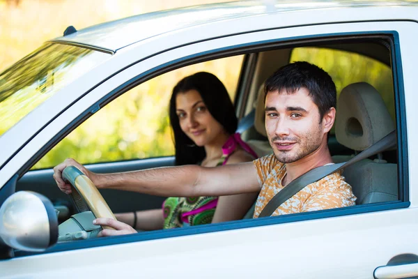 Happy couple in the car