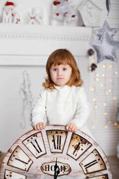 Baby girl with big clock dial