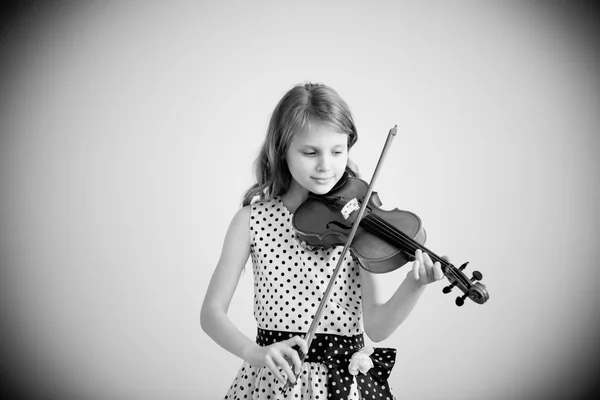 Portrait of girl with string and playing violin.