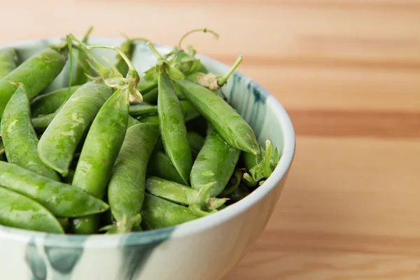 Green peas into a bowl