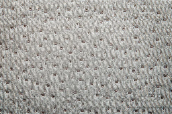 Gray fabric dotted texture. Close up