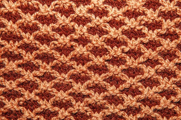 Brown knitted cloth is made by hand.