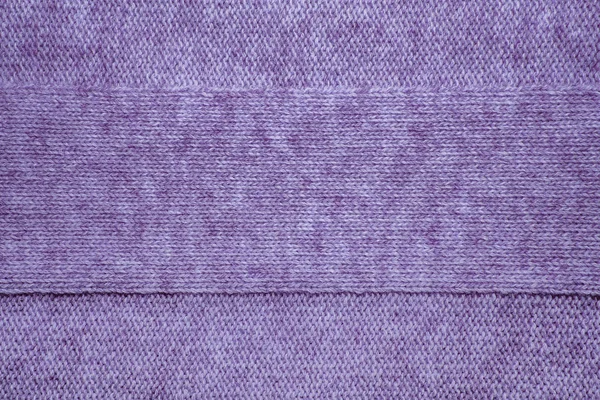 Knitted jersey background with a relief pattern