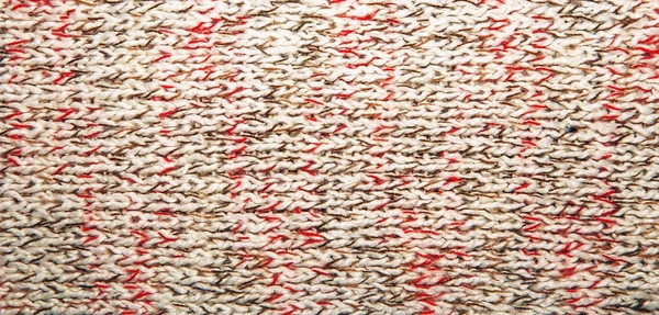 Knitted jersey background with a relief pattern