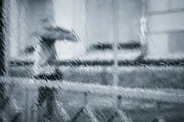 A blurry woman silhouette under the rain