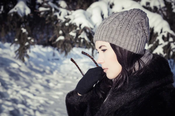 Portrait in profile of a pretty thoughtful young woman