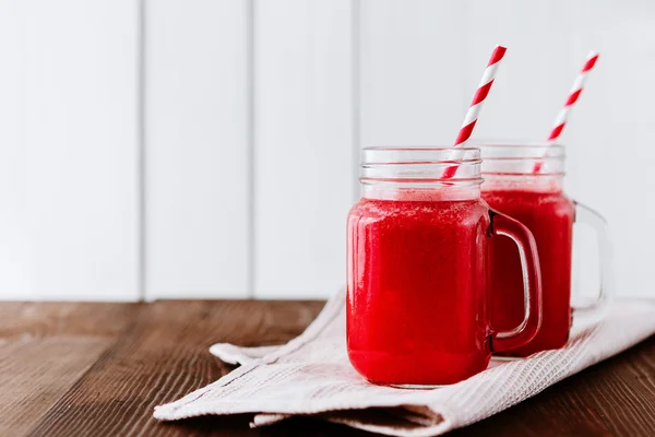 Healthy watermelon smoothie on a wood background. Freshly blended watermelon Smoothies.