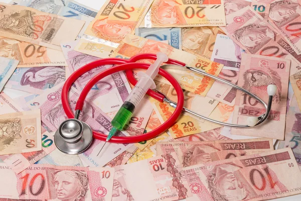 Real (Reais) bills with stethoscope