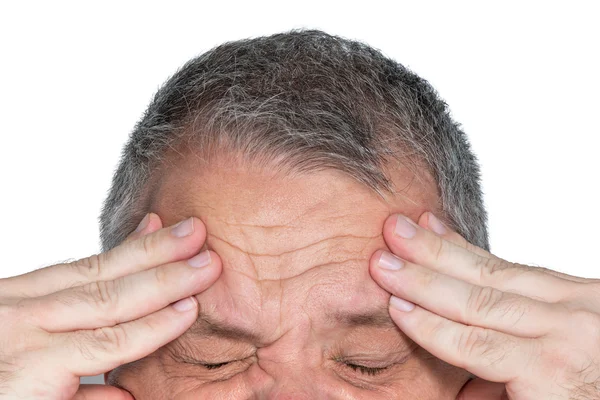 Man with hands on his forehead