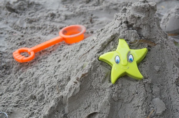 Play sand castle with plastic toy