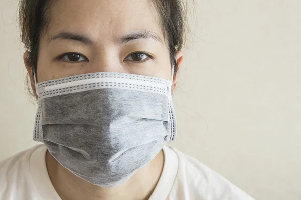 Sleepy sick woman mask flu cold health concept