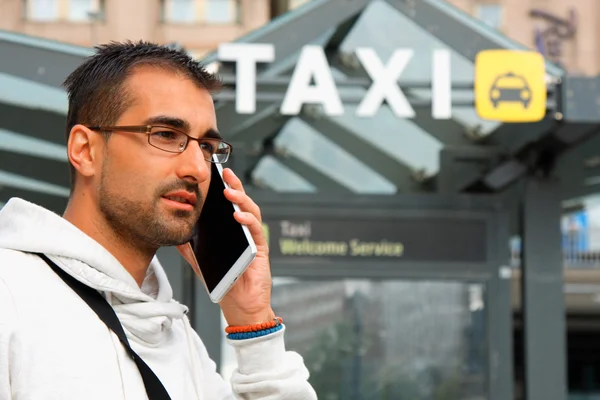 Man orders a taxi from his cell phone