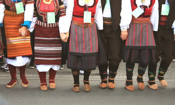 Folklore group from Serbia dressed in traditional clothing is pr