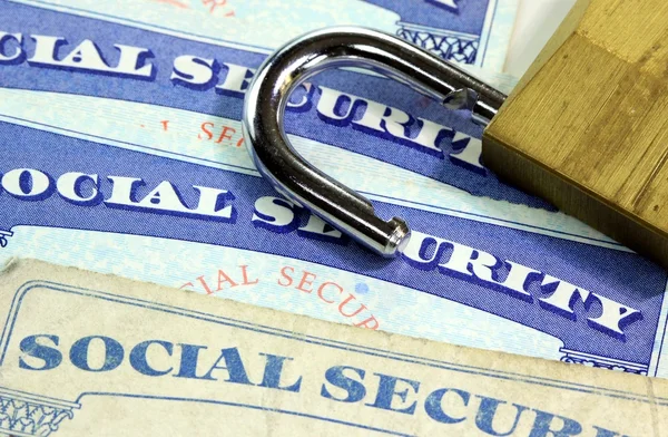 Padlock and social security card - Identity theft and identity protection concept