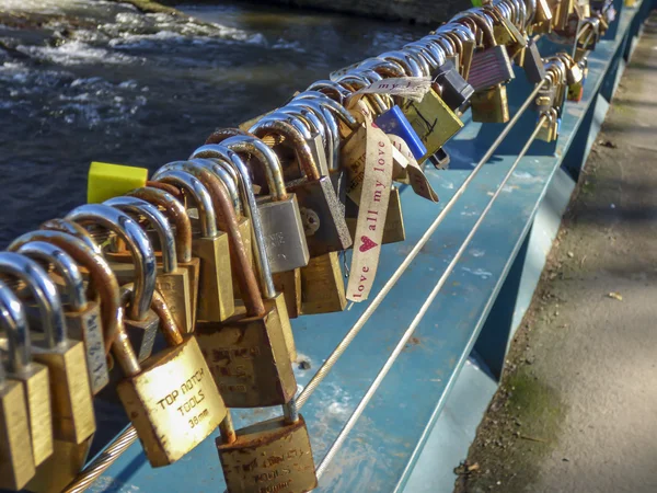 Padlocks (love locks) fastened to a bridge