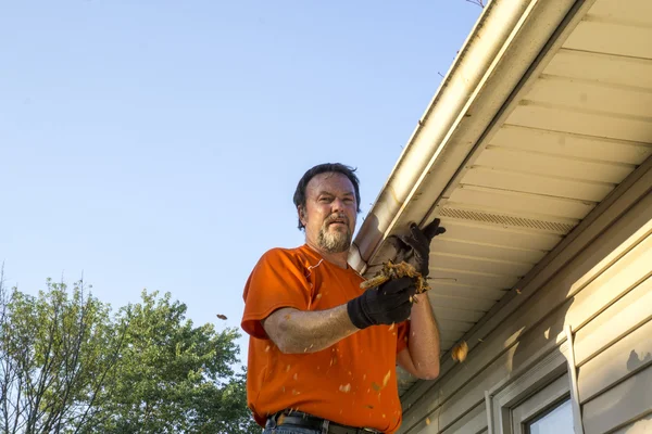 Cleaning Gutters On A Hot Day