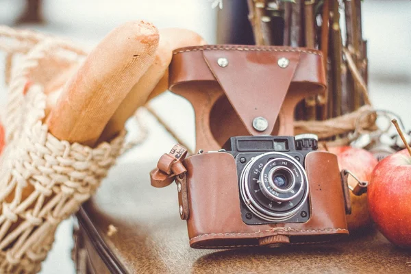 Retro camera and bag with food