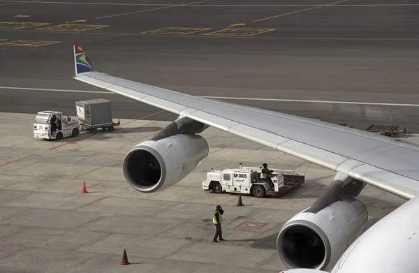 Airport workers service an aircraft at Cape Town International Airport South Africa