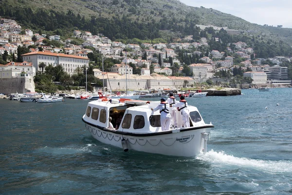 Cruise ship tender boat and crew leave Dubrovnik Croatia