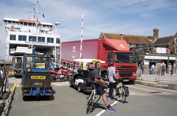 Roll on roll off ferry unloading and passengers wait to load with their cycles