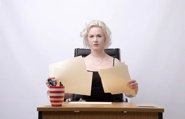 Secretary at desk with paperwork