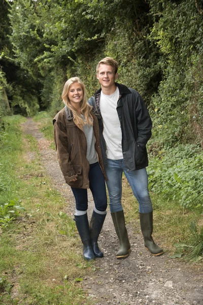 YOUNG COUPLE IN COUNTRYSIDE