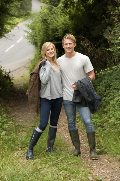 YOUNG COUPLE IN COUNTRYSIDE