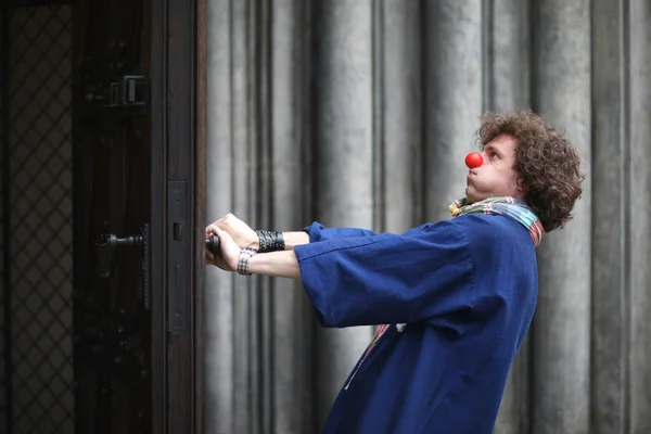 Street performance of single clown