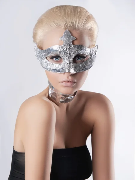 Beauty woman in foil mask
