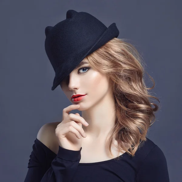 Beautiful young woman in hat