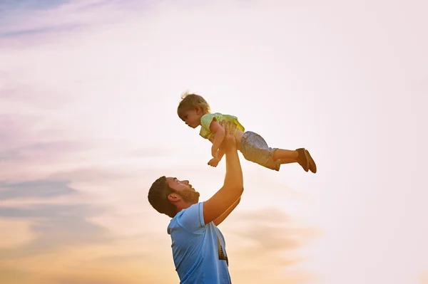Happy family. Father and son playing outdoors. The concept of father\'s day