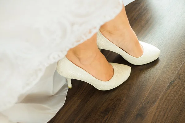Close up image of elegant floor-length wedding dress