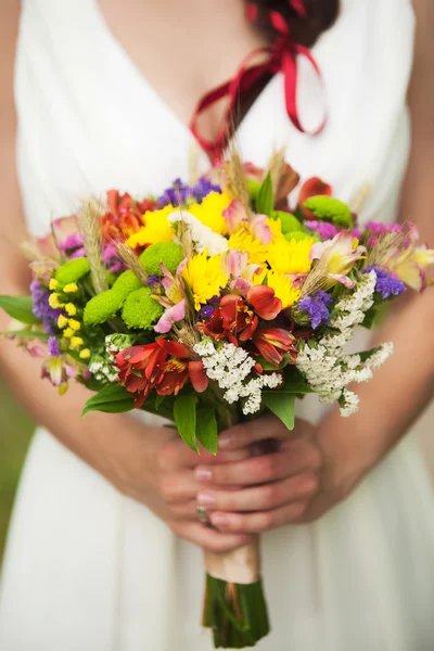 Young woman with bouquet of flowers