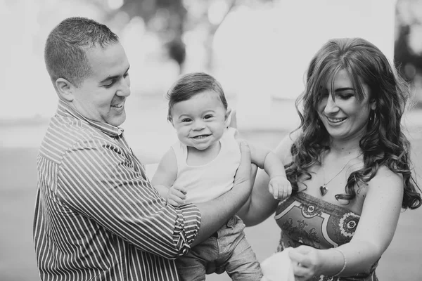 Black and white Image of happy family of three
