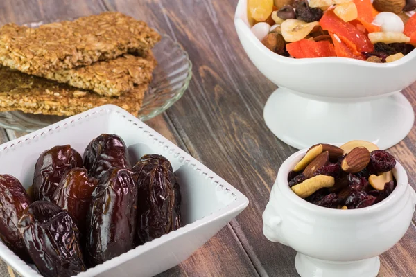 Snacks. Sweet tropical nut trail mix, granola bars and dates.