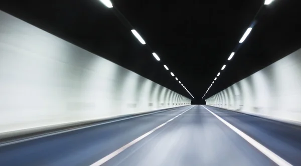 Abstract highway tunnel blured background with lights