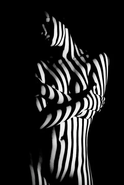 Stripes of light on naked body