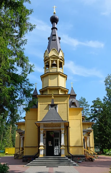 The bell tower of the Church of the Holy apostles Peter and Paul in the village of Vyritsa in the Leningrad region in the summer on a Sunny day.