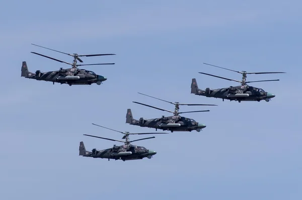 Military helicopters in blue sky
