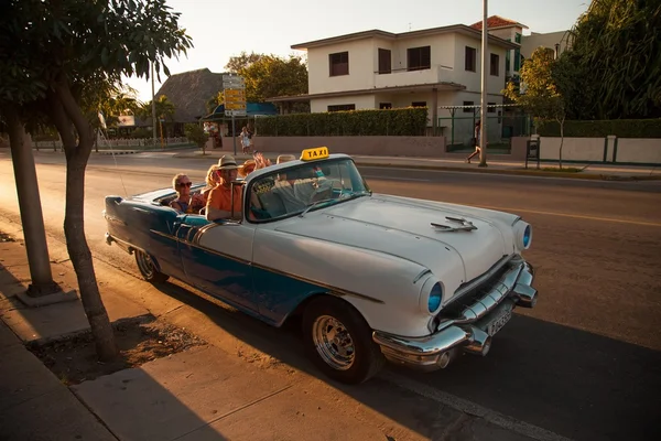 People in retro taxi