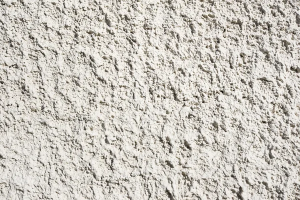 White and yellow exterior plaster, spray texture