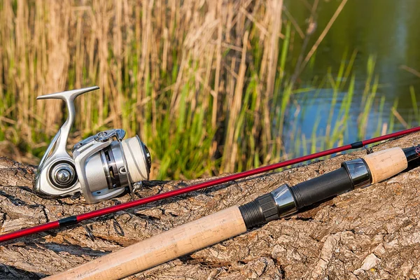 Fishing rod and reel on the natural background.