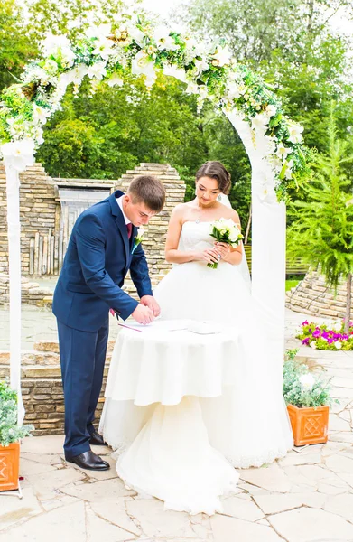 Couple Getting Married at an Outdoor Wedding Ceremony