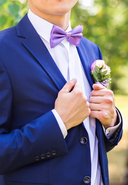 Sexy man in tuxedo and bow tie posing