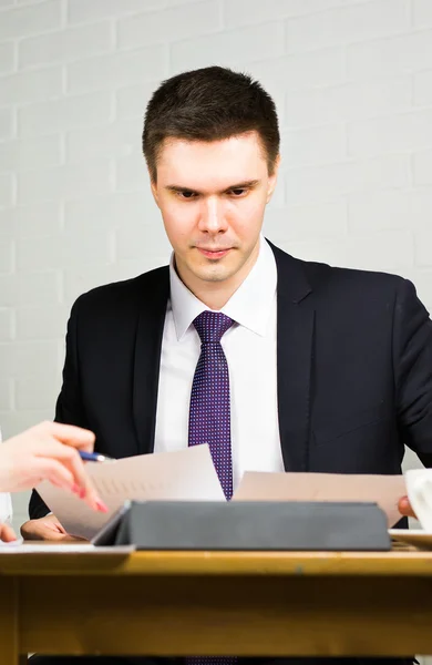 Business man working at office with documents on his desk, consultant lawyer concept