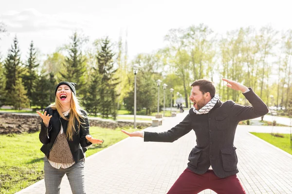 Happy couple having fun and fooling around. Joyful man with woman have nice time. Good relationship.