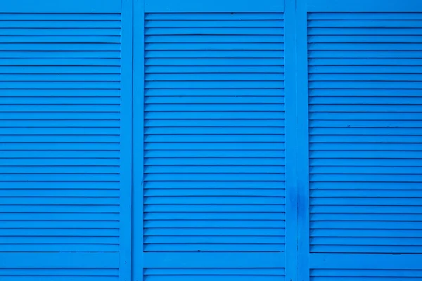 Blue shuttered roll up metal door