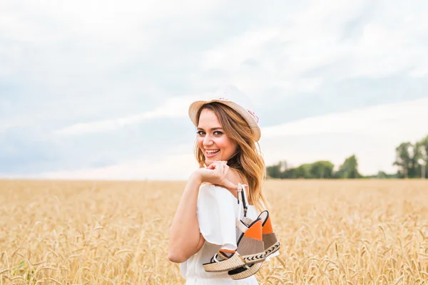 Excited woman holding new shoes that she found on sale